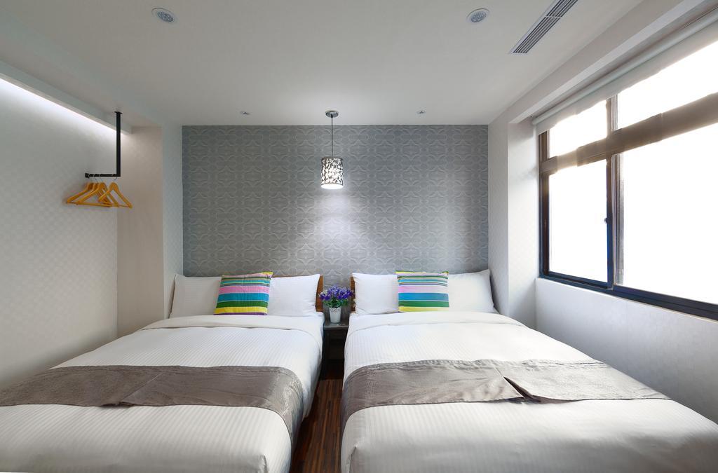 Herb Art Hotel Цзилун Номер фото