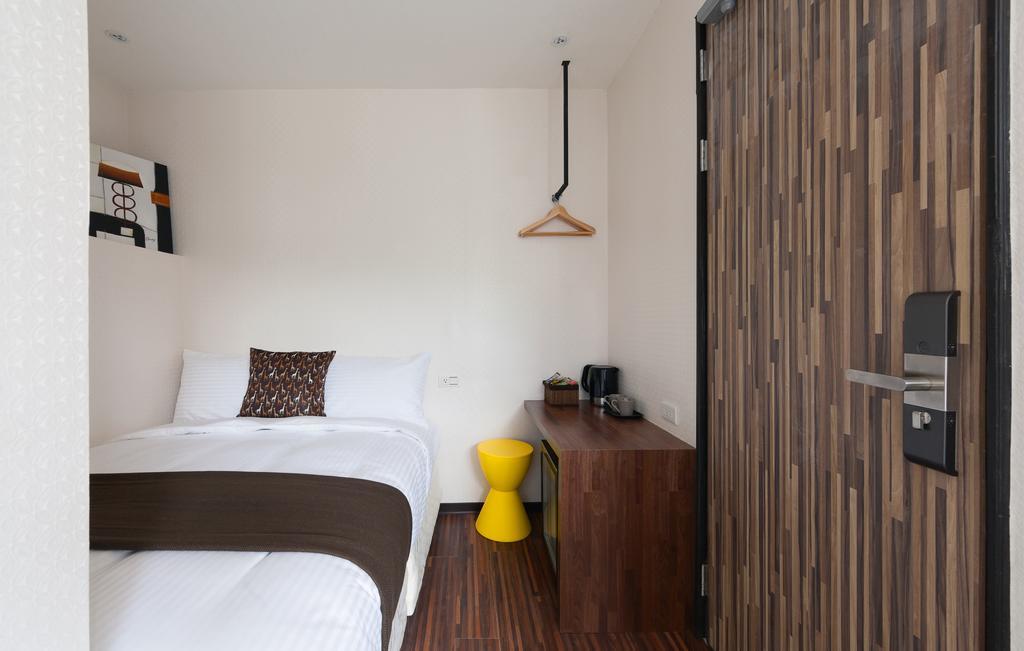 Herb Art Hotel Цзилун Номер фото