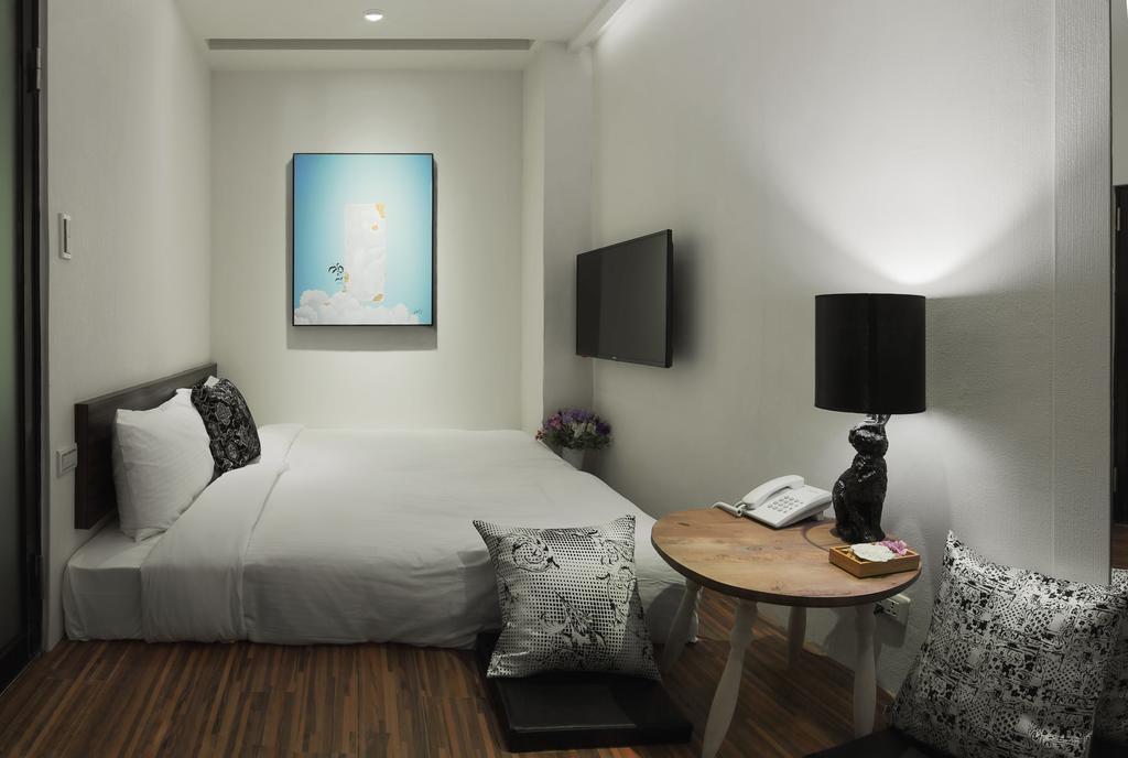 Herb Art Hotel Цзилун Номер фото