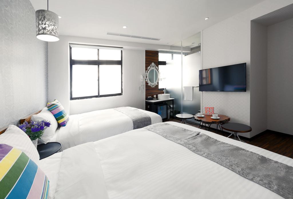 Herb Art Hotel Цзилун Номер фото